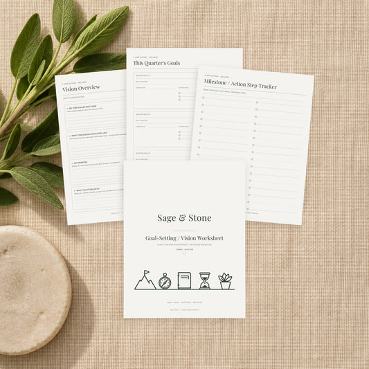 Goal-Setting and Vision Worksheet printable by Sage & Stone — quarterly goals and milestone pages shown printed on a linen surface